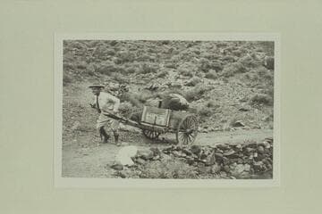 Johnny Maxson hauling dunnage from cable to cabins; Hermit Camp