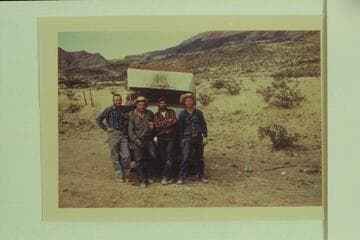 Arizona Power Authority crew with 16' Smith-Craft at the rim of Whitmore Wash:  Roy Klinger- boat pilot, Ben Bundy- supply man, Lavay Bundy- cook, Bundy- supply man