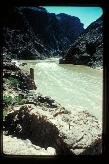 Four boats above Bright Angel Bridge