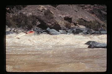 "Wee Red" climbs Vulcan Rapids
