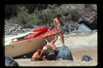 "Wee Red" on rocks; Vulcan Rapids