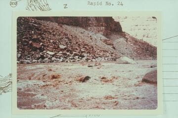 Jean and Hal Bennett in kayak near head of Rapid 22 in The Big Drop. 10,430 cfs