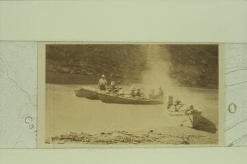 Off in a cloud of smoke.  Photo and caption by Lewis R. Freeman from his collection [image identical to V033/0164]