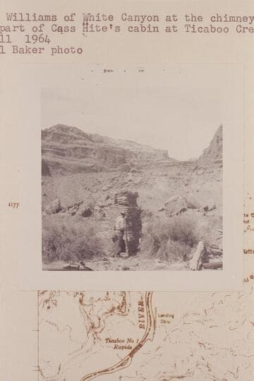 Slim Williams of White Canyon at the chimney which was part of Cass Hite's cabin at Ticaboo Creek