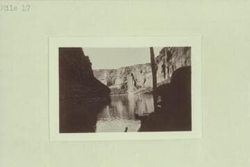 No. 120, Charles Gibbons album. Downstream view toward Sentinel Rock at mouth of Wahweap. Mile 17