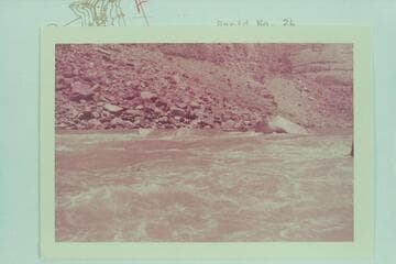 Bill Davis at head of Rapid 22. [on reverse of photo: "Rapid at mile 200. Lining would be better on left bank. Picture taken from right bank, looking up river. Water very fast..Fern Davis took picture from right bank. Very noisy rapid."