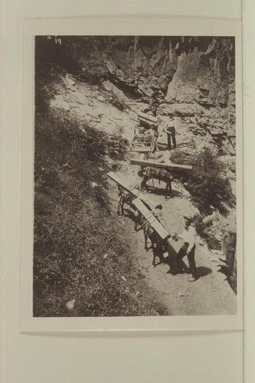 The Kolb brothers packing lumber to build their photo finishing room at Indian Gardens