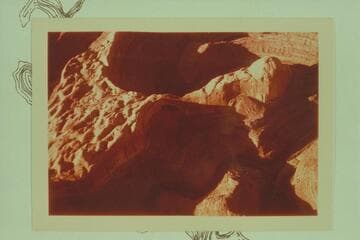 Down Escalante River. The mouth of Stevens Creek is at lower right, Stevens Arch is in the shadow at center