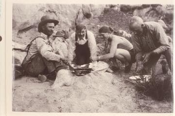 Assembling boats and camp; Hite.  Second from left is Loper, third from left is Sarah Fraser, fourth is Dave Rust (?)
