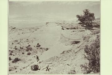 Climbing the slickrock to the bench which fronts Arch in the Sky