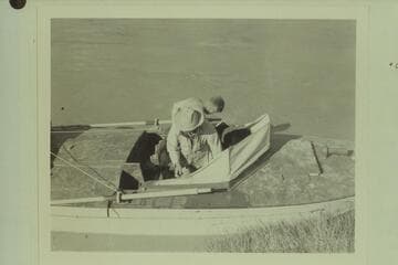 Marston and Ed Hudson make preparations for third day of cruise on the "Esmeralda"; foot of Tanner Trail