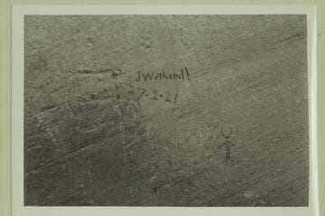 John Wetherill inscription. Mile 50.4 in Glen Canyon. In charcoal on petroglyph cliff