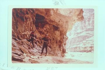 Dock Marston and Bill Belknap photographing the 1836 D. Julien inscription at Mile 185.75 left bank, Cataract Canyon