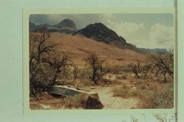 Metal boat bolted at mid-section cached at Cardenas Creek