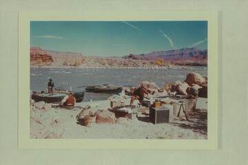 Enacting a camp scene in "The Colorado River Story," Idas Riffle. The clouds are not vapor trails