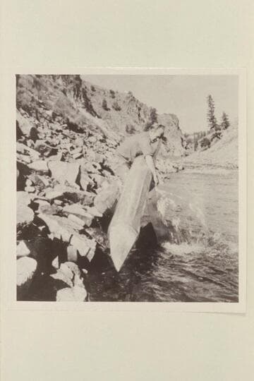 John Bergen empties water from his Skiyak at portage in Byers Canyon