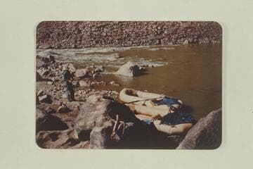 Arnold-Simmons Cataract Canyon run of 1952.  Mile 204.  Shows Dave Arnold starting to line his boat at the 5th break in Mile Long Rapid.  A 5x7 pic will probably show well enough how the gear is packed in