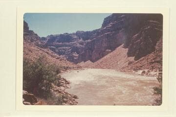 Down from approximately Mile 202.75 at head of Rapid No. 21, which heads at Mile 202.8 and drops 10 ft. in .25 miles.  The beach at right is below the mouth of Teapot Canyon.  Mile 202.7.  See Nims photos 80 and 83 and Hyde photo of 1928, Nov. 01