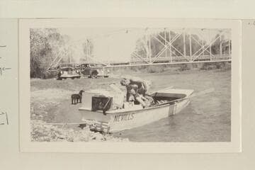 The start of the boat trip down the Dolores River from Dolores, Colorado, to Moab, Utah. Preparing for start near highway bridge at Dolores, Colorado; Pres and Becky Walker