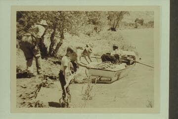 Landing the punt for lunch stop below Gateway on Dolores River