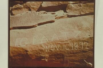 Name of F. G. Faatz cut on wall of Glen Canyon 6 miles above Lees Ferry. The same name with the date August 27 1892 is cut on the right bank of Cataract Canyon. Photo sent by Art Green, 1956, Oct. 09