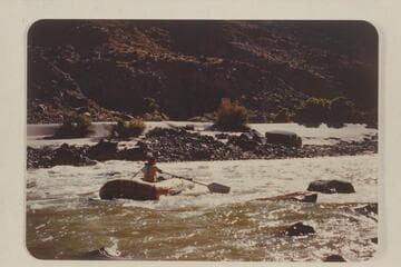 Shows a little action at 210.5 Mile Rapid and also a good view of the enlarged blade we put on the paddles
