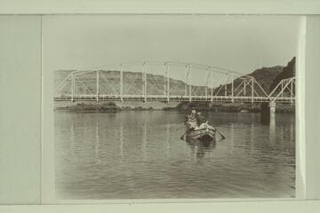 Start from Moab for run of Cataract Canyon. Nevills stands in the far boat. Marston stands in the near boat