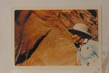 Hite inscription at small side canyon below lower end of Good Hope Bar, Mile 143.9. Harry Aleson examines it while Pete Sparkes makes the photo
