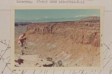 Mel Hurley at the top of South Trail. Henry Mountains in distance