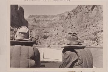 Bill Belknap, piloting, and Willie Taylor, riding, the "Cactus." The "Bootoo" cruises ahead of them below Harding Rapid