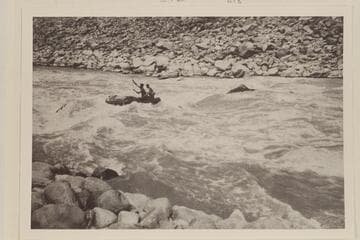 Southwest Exploration party in Cataract Canyon.  In the boat are Ken Ross and Jon Lindbergh.  "In No. 23"