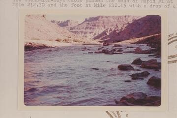 Upstream from Mile 212.0 in Cataract Canyon.  Note upturned beds flanking gypsum plug at Red Lake Canyon.  The Chenowith-Hoyt table places the head of Rapid #1 at Mile 212.30 and the foot at Mile 212.15 with a drop of 4 ft