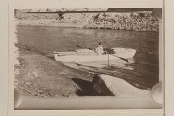 Ellsworth Kolb in boat below Rapid #4, Cataract Canyon.  U. S. Geological Survey under W. R. Chenowith