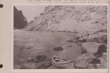 One of the Brown-Stanton Expedition boats at the head of Rapid No. 23 in Cataract CAnyon.  Mile 202.20.  Caption reads:  No. 54.  Railway Survey, Colorado River.  1889, Sta.[erased] UP