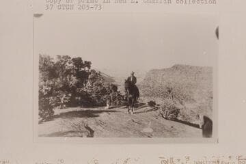 Bill Racy on Teddy. Flint Flat. The Maze over Bill's shoulder
