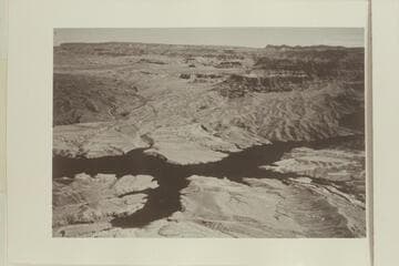 "On the extreme right is the west end of Grand Canyon where the river breaks through the Hualapai Cliffs and joins Lake Mead." Grapevine Wash is lower right. Grand Wash is upper left. The lake is partially filled