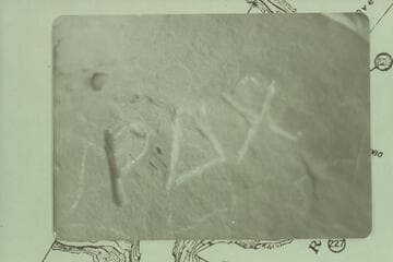 Inscription at Rippling Brook. P carved very deep; appears the AX was added later; not as deep as the P