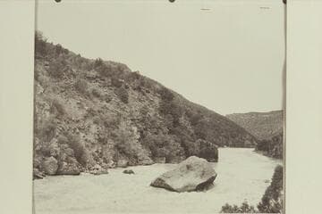 Lining boat down right bank at Ashley Falls.  Nevills party