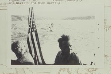 The Nevills sadirons and Aleson's outboard astern of the Park Service launch leaving Pierces Ferry; Moe Nevills and Norm Nevills