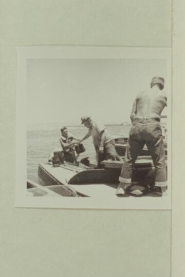 Unloading the sinking "Para Dox" at Boulder City: Buzz Belknap, Doc Reed and Doc Hill