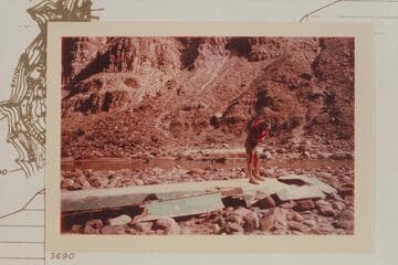 Bill Belknap examines the wrecked "Ben Hurt."  On the island at Mile 203 where it washed up after running free from an inadequate mooring up river