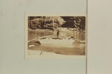Glen Hyde in the sweep-scow in which he attempted to navigate the Grand Canyon in Nov. 1928