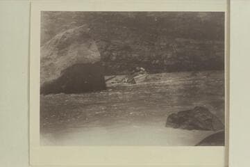 Emery Kolb hits the stern of the "Edith" on the large rock in Ashley Falls. Low water