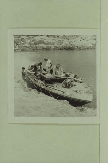 The camera boat at Separation Canyon. Roy Klinger works aft as Gordon Avil watches. Jim Algar studies the script