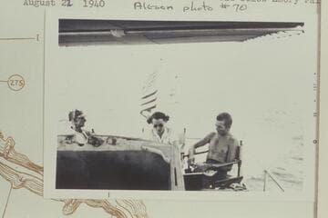 Louis West; Doris Nevills; Hugh Cutler in the stern sheets of the Park Service launch on Lake Mead below Emory [sic] Falls