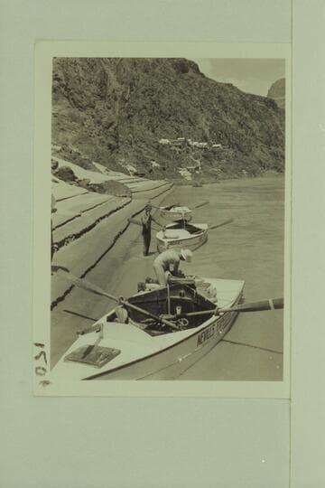 The three Nevills sadirons pulled in at the beach at Bridge Canyon City.  Bruce Wilson is on the near boat.  Pres Walker stands at the shore.  Mile 238.7