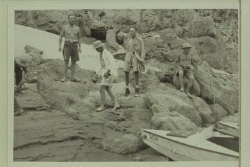 The meeting of the Aleson and Nevills parties, Separation Canyon.  Charles Larabee at left, then Harry Aleson, Lewis West, and Del Reed