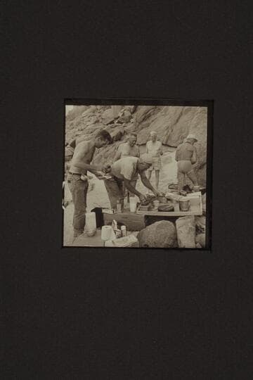 Digging in for chow at Diamond Creek. Hugh Cutler; Willie Taylor; Rod Sanderson; Joe Desloge; Marston. Note the coffee grainder