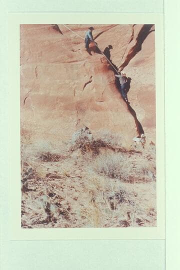 On the trail between the middle fork and the southwest fork--73.6. Eisaman photographed Archeyes Masland going up the rope