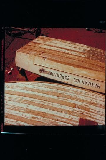 Mexican Hat Expedition motor boat showing battering; Wright's yard at Blanding